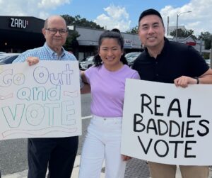 Kam Shenai (left) standing with his fellow co-founders, Onchantho Am (middle) and Ricky Ly (right), on East Colonial Drive on National Voter Registration Day.